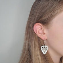 Load image into Gallery viewer, blond-model-wearing-silver-guitar-pick-earrings.jpg