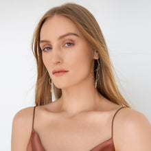 Load image into Gallery viewer, gold-wired-earrings-music-collection-on-a-model