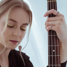 Load image into Gallery viewer, martha-kovalchuk-from-ultramarine-girls-band-wearing-guitar-string-rings.jpg