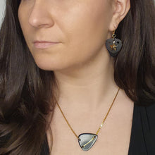 Load image into Gallery viewer, model-wearing-black-guitar-pick-with-gold-star-pendant-earrings.jpg