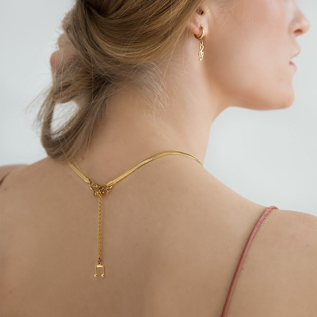 black and gold choker on a model