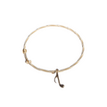 gold-music-note-pendant-guitar-string-bracelet.png