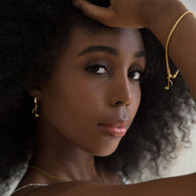 Load image into Gallery viewer, gold-song-music-note-bracelet-on-a-dark-skin-model
