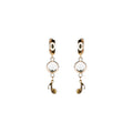 golden eye crystal and music note pendant earrings