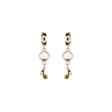 Load image into Gallery viewer, golden eye crystal and music note pendant earrings
