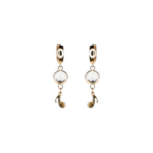Load image into Gallery viewer, golden eye crystal and music note pendant earrings
