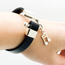 Load image into Gallery viewer, model-wearing-a-black-leather-with-a-silver-note-pendant.jpg
