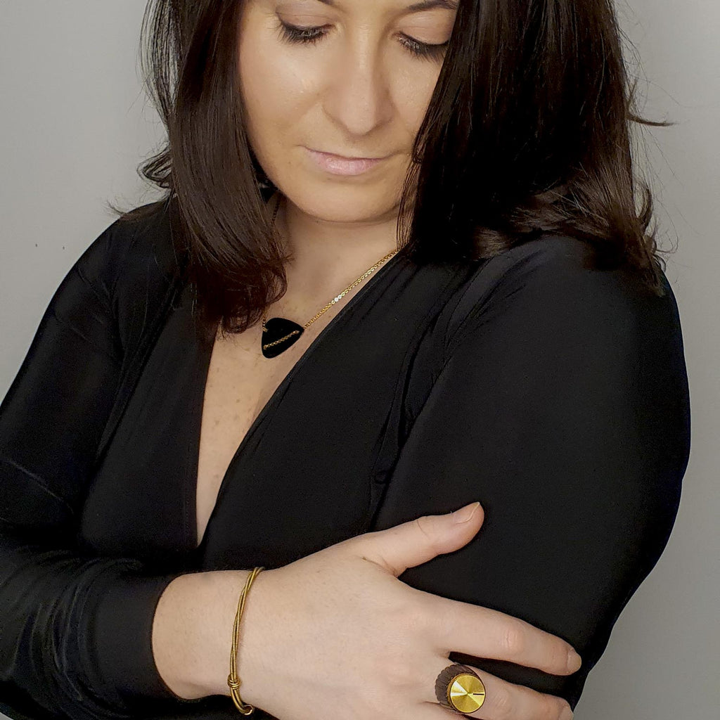 model-wearing-black-guitar-pick-necklace-heartbeat-london-rock-collection.jpg