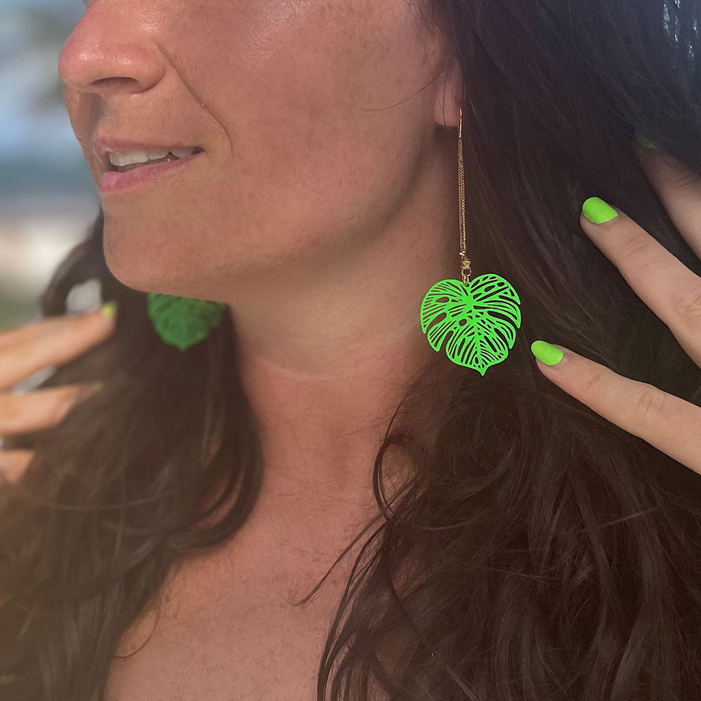 tilum-collection-green-leaf-earrings-on-a-model.jpg