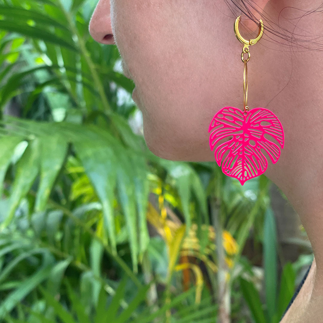 tulum-collection-pink-leaf-earrings-on-a-model.jpg